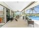 View of screened lanai featuring exercise equipment and pool view at 167 & 169 Marker Rd, Rotonda West, FL 33947