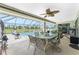 View of screened lanai featuring covered seating area with pool view at 167 & 169 Marker Rd, Rotonda West, FL 33947