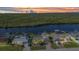 Scenic aerial view of waterfront homes with docks and lush green surroundings at 18566 Arapahoe Cir, Port Charlotte, FL 33948