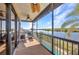 A view from the balcony over looking the canal and a pool below at 18566 Arapahoe Cir, Port Charlotte, FL 33948