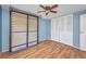 Neutral bedroom featuring wood floors and a standard closet at 18566 Arapahoe Cir, Port Charlotte, FL 33948