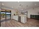 Kitchen with island, stainless steel appliances, and sliding glass doors to the pool area at 18566 Arapahoe Cir, Port Charlotte, FL 33948