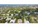 A picturesque aerial view of the community, showcasing lush greenery, waterways, and houses at 2131 Heasley Rd, Englewood, FL 34223