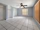 This bedroom has tile flooring, vertical blinds, and lots of space for furniture at 2131 Heasley Rd, Englewood, FL 34223