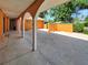 A covered carport supported by white columns offering ample parking space and protection from the elements at 2131 Heasley Rd, Englewood, FL 34223