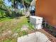 Exterior view showing generator next to the house in the lawn at 2131 Heasley Rd, Englewood, FL 34223
