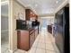Functional kitchen features wood cabinetry and granite countertops at 2131 Heasley Rd, Englewood, FL 34223