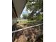 Spacious fenced backyard featuring a grassy area and playset with a lovely dog running around at 2174 Schwalbe Way, Sarasota, FL 34235