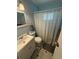 Traditional bathroom with a combined shower and tub, and a single sink vanity at 2174 Schwalbe Way, Sarasota, FL 34235