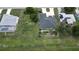 High-angle view of a well-kept home with a circular driveway and manicured landscaping at 2244 Mauritania Rd, Punta Gorda, FL 33983