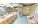Bright bathroom featuring double sinks, a bidet, tile flooring and large glass shower at 2244 Mauritania Rd, Punta Gorda, FL 33983