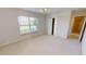 Bright bedroom features a large window and closet, providing ample natural light and storage space at 2244 Mauritania Rd, Punta Gorda, FL 33983