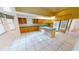 Well-lit kitchen with ample cabinetry, tile flooring, and plenty of counter space at 2244 Mauritania Rd, Punta Gorda, FL 33983