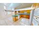 Inviting kitchen featuring a center island, tile floors, and great natural light at 2244 Mauritania Rd, Punta Gorda, FL 33983