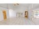 Open-concept living room with tile floors and convenient access to multiple living spaces at 2244 Mauritania Rd, Punta Gorda, FL 33983
