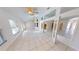 Bright and airy living room with tiled flooring, abundant natural light, and neutral decor at 2244 Mauritania Rd, Punta Gorda, FL 33983
