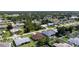 Residential neighborhood aerial view featuring lush green spaces and diverse housing styles at 23101 Hillsdale Ave, Port Charlotte, FL 33954