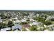 Wide aerial view of a neighborhood with various homes, lush greenery, and well-maintained lawns at 23101 Hillsdale Ave, Port Charlotte, FL 33954