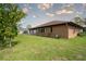 The home has a spacious backyard featuring a well-maintained lawn and access to the home at 23101 Hillsdale Ave, Port Charlotte, FL 33954