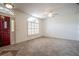 Bright foyer with tile flooring, a decorative front door, and natural light from a large arched window at 23101 Hillsdale Ave, Port Charlotte, FL 33954