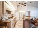 Bright kitchen features a stove, eat-in bar, and tile floors at 23101 Hillsdale Ave, Port Charlotte, FL 33954