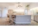 Kitchen with tile floors, eat-in bar, and stainless steel appliances at 23101 Hillsdale Ave, Port Charlotte, FL 33954