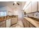 Bright kitchen features a dishwasher and tile floors at 23101 Hillsdale Ave, Port Charlotte, FL 33954