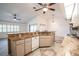 Kitchen and living area with vaulted ceiling and tile floors at 23101 Hillsdale Ave, Port Charlotte, FL 33954