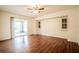 Spacious living room with sliding glass door and hardwood floors at 23101 Hillsdale Ave, Port Charlotte, FL 33954