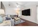 Comfortable living room with hardwood floors and ceiling fan at 2373 Chartwell Ave, North Port, FL 34288