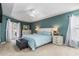 Tranquil main bedroom featuring tray ceiling, plush carpet, and French doors to outdoor area at 2373 Chartwell Ave, North Port, FL 34288
