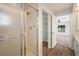 Bathroom showcasing a shower, access to the closet, and a view of the bedroom enhance daily routines at 24261 Captain Kidd Blvd, Punta Gorda, FL 33955