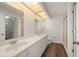 Bathroom with a double sink vanity, a full shower, and modern lighting create a relaxing atmosphere at 24261 Captain Kidd Blvd, Punta Gorda, FL 33955