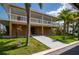 Beautiful two-story coastal home with a spacious balcony and a private boat dock for easy waterfront access at 24261 Captain Kidd Blvd, Punta Gorda, FL 33955