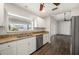 Updated kitchen with modern appliances and granite countertops with backyard view at 24261 Captain Kidd Blvd, Punta Gorda, FL 33955