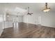 Spacious living area boasts high ceilings, laminate floors and a ceiling fan for added comfort at 24261 Captain Kidd Blvd, Punta Gorda, FL 33955