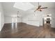 Large living room with a skylight, seamlessly connects to the kitchen and dining area at 24261 Captain Kidd Blvd, Punta Gorda, FL 33955