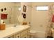 Bathroom features a vanity with sink, mirror, and shower-tub combo at 2467 Herron Ter, Port Charlotte, FL 33981