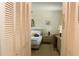 Bedroom view through closet doors, featuring a bed and side table at 2467 Herron Ter, Port Charlotte, FL 33981