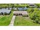 Inviting one-story home with mature landscaping, long driveway, and access to a canal for boating and waterside relaxation at 2467 Herron Ter, Port Charlotte, FL 33981