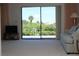 Bright living room with sliding glass doors leading to outdoor scenery and neutral carpet at 2467 Herron Ter, Port Charlotte, FL 33981