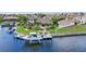 Aerial view of a house with a boat dock and lift on a canal at 250 Freeport Ct, Punta Gorda, FL 33950