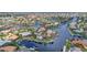 This captivating aerial view showcases waterfront homes with docks lining the scenic canals of a beautiful residential community at 250 Freeport Ct, Punta Gorda, FL 33950