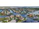 An elevated view of a waterfront community highlights the unique canal system and luxurious homes at 250 Freeport Ct, Punta Gorda, FL 33950