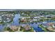 Aerial view of luxurious waterfront homes nestled along winding canals, showcasing upscale coastal living at 250 Freeport Ct, Punta Gorda, FL 33950