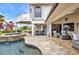 A stunning backyard with a pool, spa, and lush landscaping, creating a private oasis at 250 Freeport Ct, Punta Gorda, FL 33950