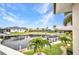 Waterfront view showcasing a canal, docks, and boats from an elevated balcony at 250 Freeport Ct, Punta Gorda, FL 33950