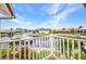 Charming balcony with panoramic views of the canal waterway and neighborhood homes at 250 Freeport Ct, Punta Gorda, FL 33950