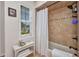 A bathroom displaying a tiled shower and bathtub with a white shower curtain at 250 Freeport Ct, Punta Gorda, FL 33950