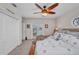 Comfortable bedroom with ceiling fan, closet, and sliding door offering exterior view at 250 Freeport Ct, Punta Gorda, FL 33950